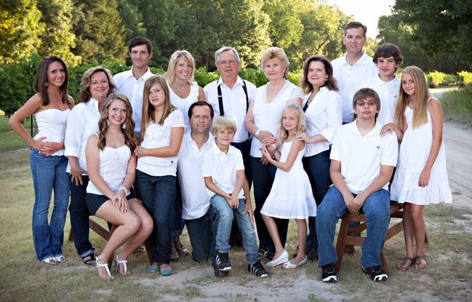 Picture of entire Mitas family of three generations in the vineyard.